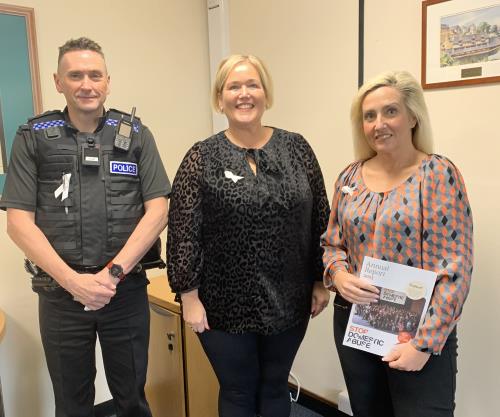 Inspector Rob Kearley, with Cllr Joanne Burton and Claire Lambon from Stop Domestic Abuse